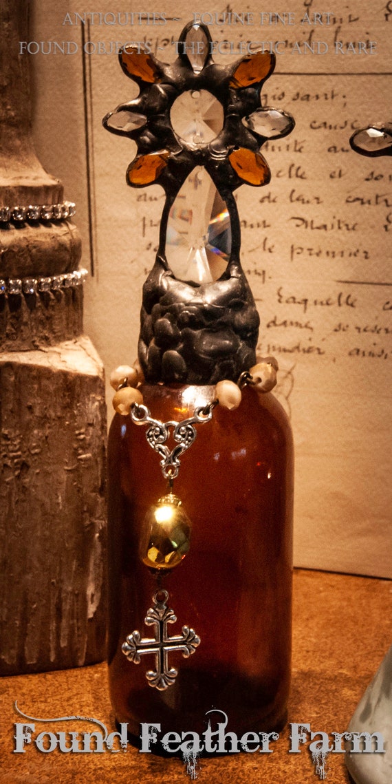 Heirloom Whispers Collection Handmade Mahogany Toned Glass Cross Bottle With a Century Old Antique Glass Bottle Base