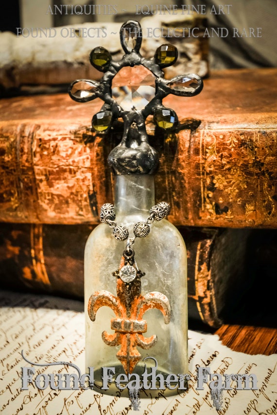 Heirloom Whispers Collection Handmade Grungy Glass Cross Bottle With a Century Old Antique Glass Bottle Base and Vintage European Crystals