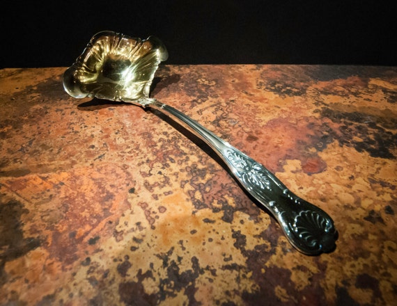 English Silver Plate and Gold Ladle