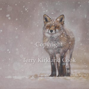 May include: A red fox stands in a snowy field, looking directly at the viewer. The fox has a soft, fluffy tail and a white muzzle. The background is a soft, muted brown with white snow falling.