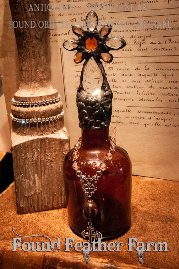 Heirloom Whispers Collection Handmade Mahogany Colored Glass Cross Bottle With a Century Old Antique Glass Bottle Base