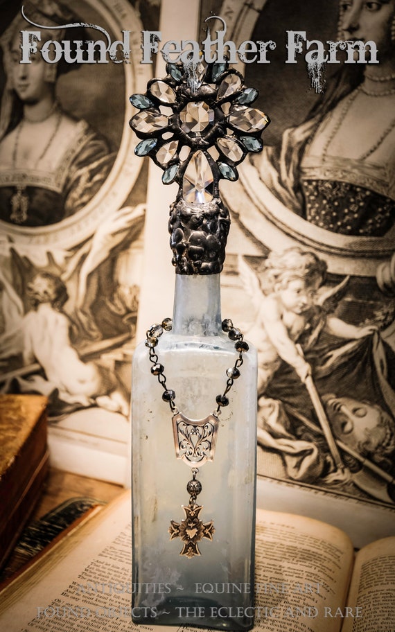 Heirloom Whispers Collection Handmade Glass Cross Bottle With a Century Old Antique Glass Bottle Base and Vintage European Crystals