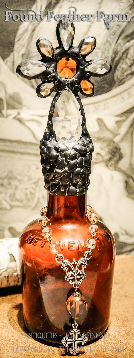 Heirloom Whispers Collection Handmade Mahogany Colored Glass Cross Bottle With a Century Old Antique Glass Bottle Base