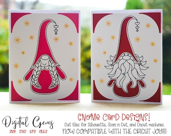 May include: Two digital cut files for crafting, featuring a gnome design. The gnome on the left has long braids and a heart-shaped hat. The gnome on the right has a beard and a heart-shaped hat. Both gnomes are red and white with a white background. The text "Gnome Card Designs!" is at the bottom of the image.