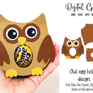 May include: A brown owl-shaped paper craft egg holder with large black and white eyes, holding a Cadbury Creme Egg. The design includes cut files for Cricut, Silhouette, and Scan n Cut machines.