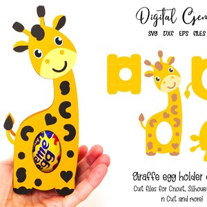 May include: A yellow giraffe-shaped egg holder with black spots and heart-shaped cutouts, holding an egg. The design includes separate cut files for crafting. Text on the image reads "Digital Gems" and "Giraffe egg holder design."