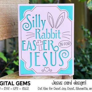 May include: A pink card with a turquoise border and a cut-out design of a bunny rabbit with the text "Silly Rabbit Easter is for Jesus".