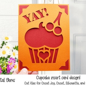 May include: A red and orange card with a cupcake design and the word "YAY!" in white. The card is designed for use with a cutting machine.