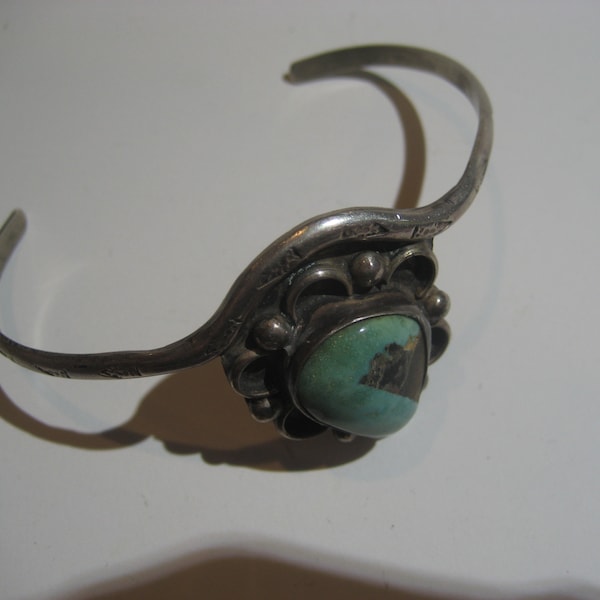 Unique Vintage Native American NAVAJO Sterling Silver Turquoise Bracelet. Based on the shape probably made by Wilson Tsosie