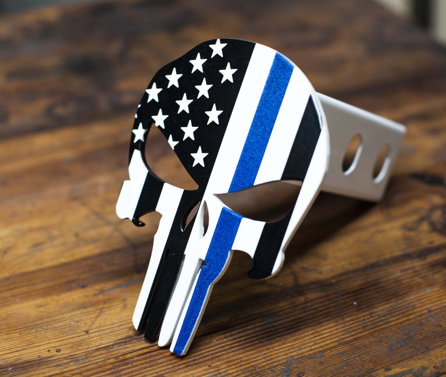 Punisher flag trailer hitch cover USA with a blue line 