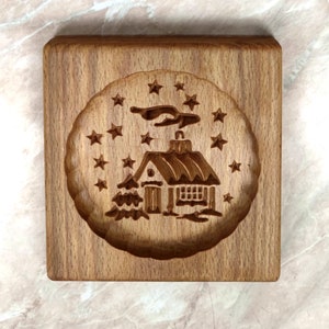 Gingerbread mold pattern carved. House with stars. Wooden cookie cutter. Baking Springerle stamp