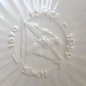 May include: White ceramic plate with a raised design of a ship and the text "ISRAEL 1950 - OBI - SIMIN".
