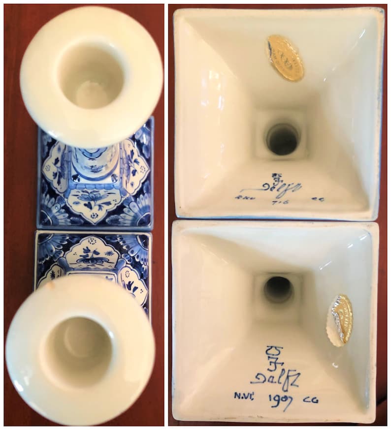 May include: Pair of blue and white Delftware candlestick holders with a gold sticker on the bottom that reads "Delftz 1909." The bottom of the candlestick holders also has the text "N.V.C."