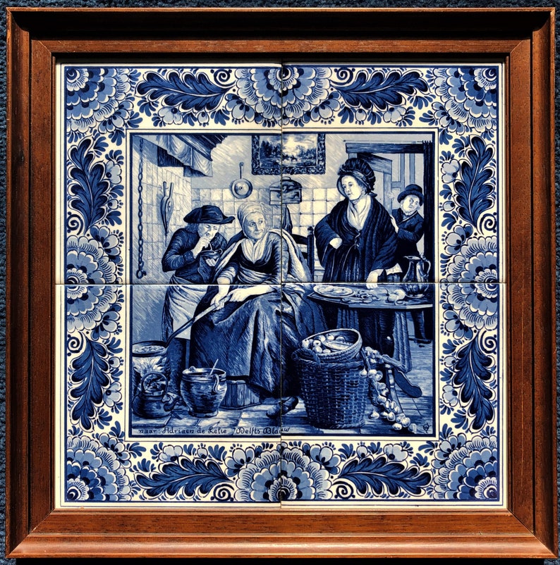 May include: A blue and white Delft tile depicting a scene of three people in a kitchen. The tile is framed in a wooden frame. The tile features a woman sitting in a chair, a man standing, and a woman standing in the background. The tile is decorated with floral designs.