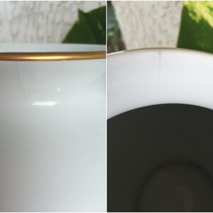 Puede incluir: Primer plano de un jarr&oacute;n de cer&aacute;mica blanco con borde dorado. El jarr&oacute;n tiene un acabado liso y brillante y se puede ver una ligera grieta en el lateral. El interior es oscuro, contrastando con el exterior brillante.