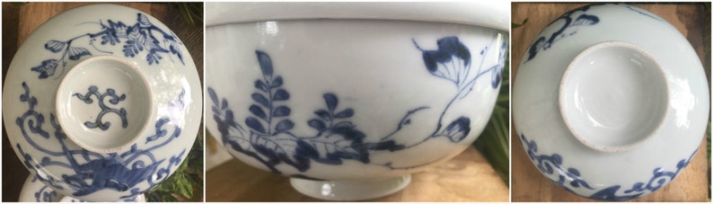 May include: White porcelain bowl with blue floral and leaf patterns. The bowl has a small, attached dish in the center. The design is repeated on the underside of the bowl. The bowl is a traditional Asian design.