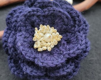 Crochet knitted brooch in blue and pearly