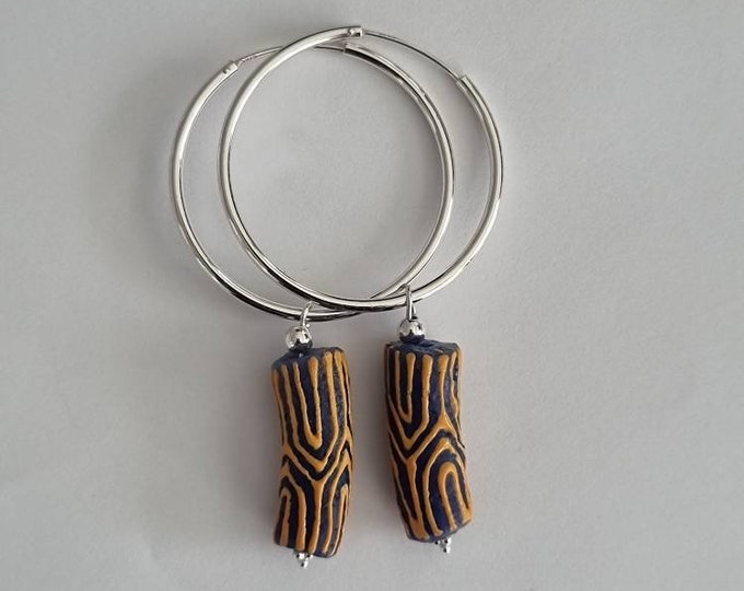Large silver hoops earrings. Recycled jewelry. Recycled beads. African beads. Sustainable jewelry. Handmade in Denmark. Boho fashion.