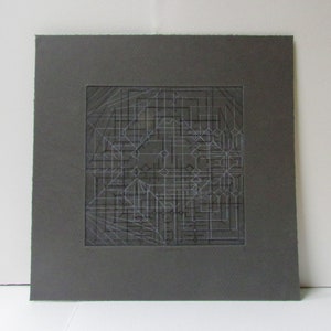Hand printed geometric etching on gray paper