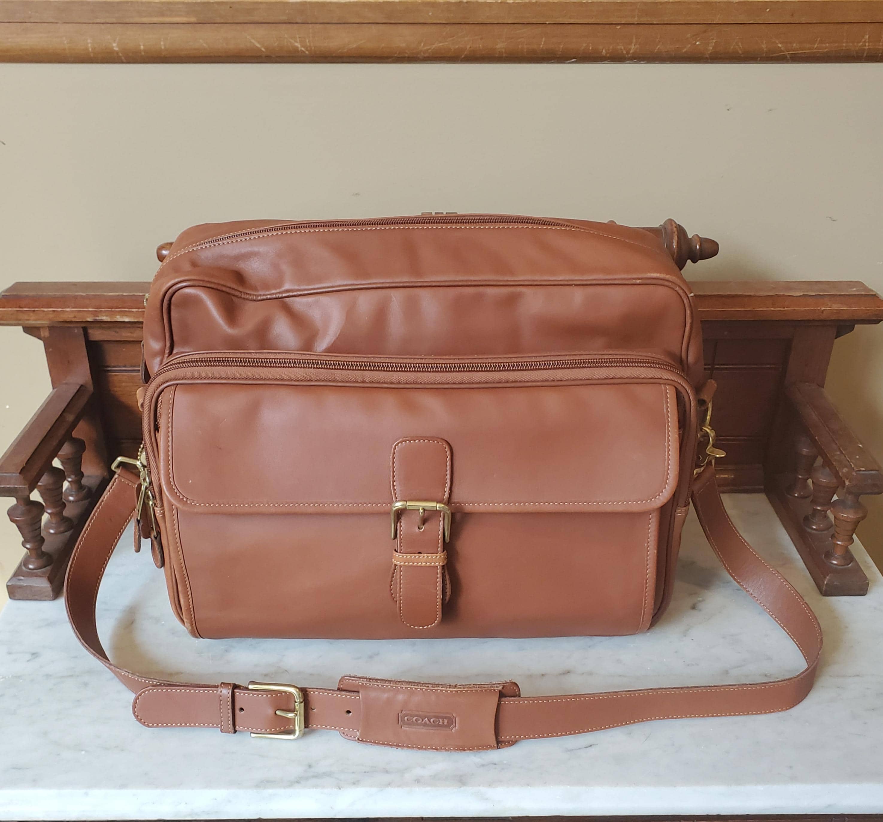Coach Vtg Tan Leather Crossbody Bag Strap Antique Brass Buckle Stitched Normcore Authentic Vintage Coach signature turnlock shoulder bag in  main image 3