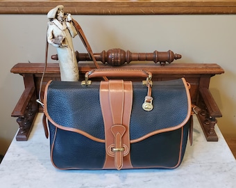 Vintage Dooney & Bourke Legal Brief Blue All Weather Pebbled Leather Tan Trim And Adjustable Strap Style 12 United States Made EUC