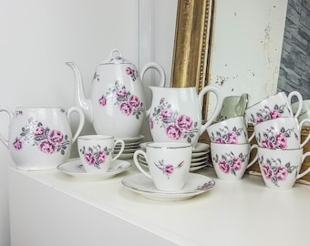 Tea service in white porcelain and floral pattern Tea cup Teapot Milk jug Sugar bowl Old service