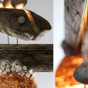 May include: A rustic wooden lamp with a fish-shaped design and a woven shade. The lamp is decorated with small stones and has a warm, inviting glow.