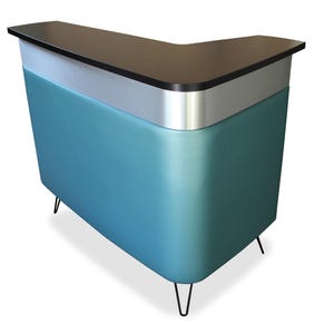 May include: A retro-style, L-shaped reception desk. The desk features a teal blue front, a silver band, and a black countertop. It stands on black hairpin legs, offering a mid-century modern aesthetic. Ideal for a business or home office.