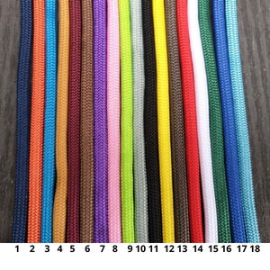May include: A close-up of 18 colorful cords in various shades, including blue, orange, yellow, purple, pink, green, and white. The cords are arranged vertically, side by side, with numbers 1 through 18 at the bottom. The cords have a textured appearance.
