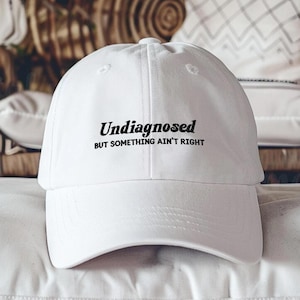 Undiagnosed But Something Ain&#39;t Right Embroidered Hat, Funny Mental Health Humor Cap, Sarcastic Anxiety Quote Dad Hat, Snarky Statement Hat