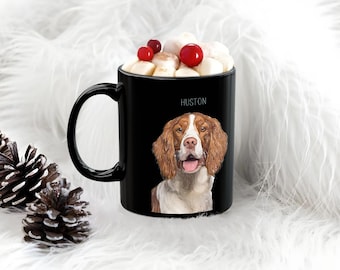 May include: Black ceramic mug with a white dog illustration and the name "Huston" printed on the side. The mug is filled with marshmallows and red berries.