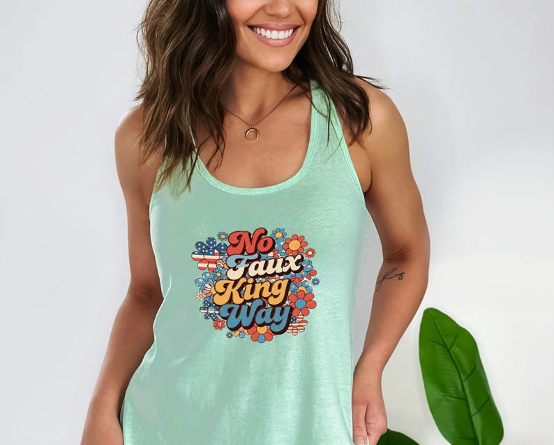May include: A light green tank top with a retro graphic that reads "No Faux King Way" in a colorful floral design. The text is in a mix of fonts and colors, with a vintage aesthetic.