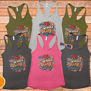 May include: A collection of six racerback tank tops in various colors, including olive green, gray, and pink. Each tank top features the text "No Faux King Way" surrounded by a floral design with patriotic colors.
