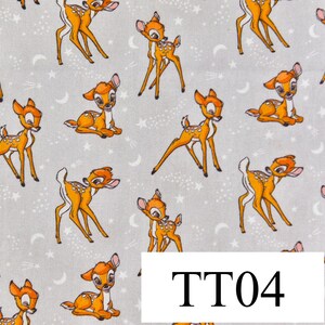 May include: A white fabric with a repeating pattern of brown deer silhouettes. The deer are in various poses, including standing, running, and jumping. The fabric has a subtle sparkle effect, giving it a whimsical feel.