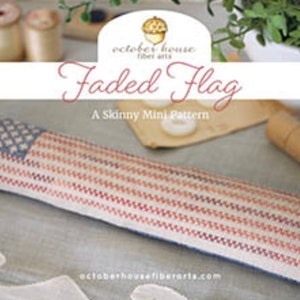 May include: A long, rectangular pillow with a faded American flag design. The pillow features red and white stripes and a blue field with white stars. The text "Faded Flag" and "A Skinny Mini Pattern" are visible.