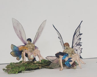 Love fairies.realistic Fairy male and female couple. Resting  in his arms love faries. Fairy miniature figurines. Romantic fairy couple