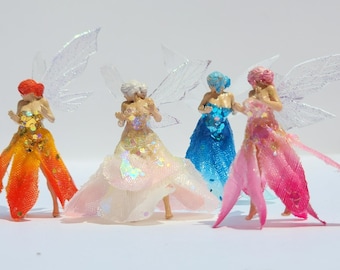 Realistic faerie miniature. Fairy in a flower dress. Miniature garden and Terrarium fairy princess. Dancing Fairy in glittery gown.