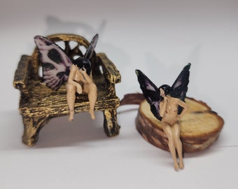 Skull winged fairy. Halloween Nude gothic fairy with skull wings. Minature garden and terrarium fairies. Emo fairy. Sitting realistic fairy