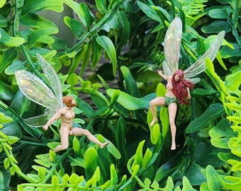 Fairy garden minature fairy figurines. Happy jumping Light skinned fairies. Flying Nude  bearded Man fairy. Red head Nude Female fairy.