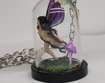 Fairy enclosed in glass dome.Realistic trapped Fairy with dreadlocks. Minature Purple fairy charm on a chain. Fairy terrarium minature.