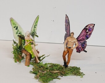 woodland fairy garden miniatures. man and woman fairy. leafy fairy.moth wing fairy. Sitting girl fairy. Hunky male fairy.Terrarium miniature