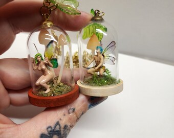 Fairy miniatures  inside a glass dome. Realistic fairy terrariums.Trapped Fairy with mossy grass and mushrooms. Man/boy fairy miniature.