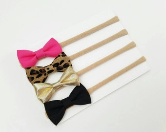 Hot pink, Leopard Print, Gold and Black itty-bitty bows. Set of 4 headbands. One size fits all nylon headbands. Baby Headbands. Bows.