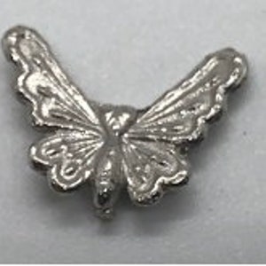 May include: Silver butterfly charm with intricate details. The butterfly has a delicate, detailed design with a slightly raised texture.