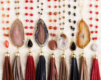 Various Styles of Red, Black, Brown, and Orange Leather Tassel Necklaces with Gold Toned Chain