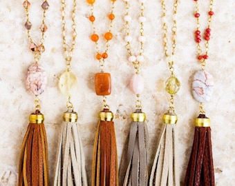 Various Styles of Tan, Brown, and Orange-Brown Leather Tassel Necklaces with Gold Toned Chain