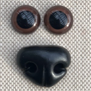 Handmade nose for dog and plastic eyes.