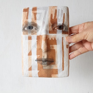 Terracotta orange and white tile face sculpture with sawtooth pattern, ceramic wall art, tribal style art lover gift