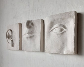 White wall art triptych, handmade ceramic classic sculpture of face in three parts, hear no see no speak no evil