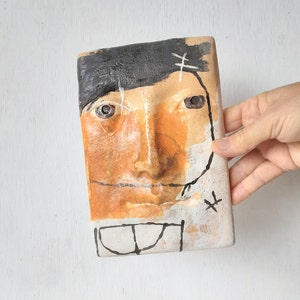 Black white and orange abstract ceramic face, pottery wall sculpture, 3D modern artwork for female birthday gift, Australian made